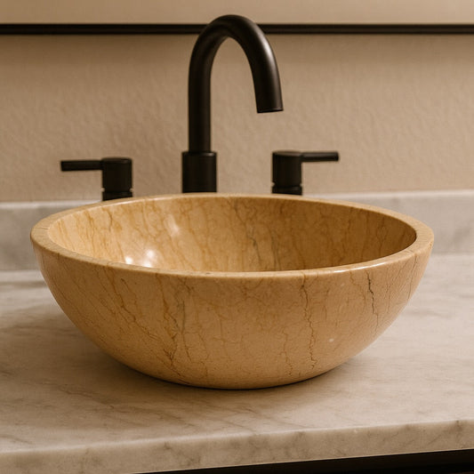 Bathroom sink with a bowl-shaped basin and black faucet against a beige wall.